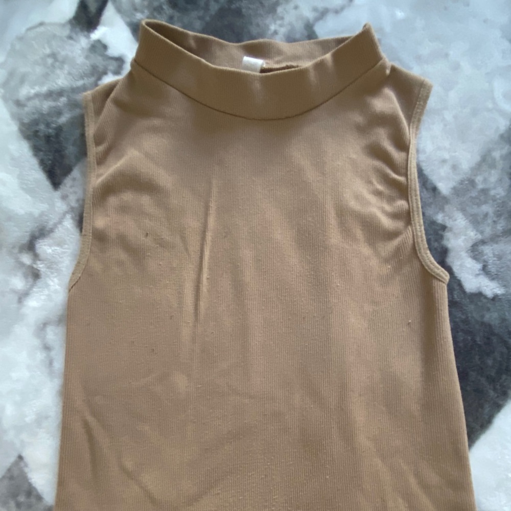 Ribbed sleeveless mock neck top